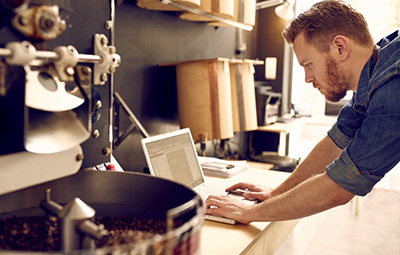 a coffee blender working on his mix in an industrial unit